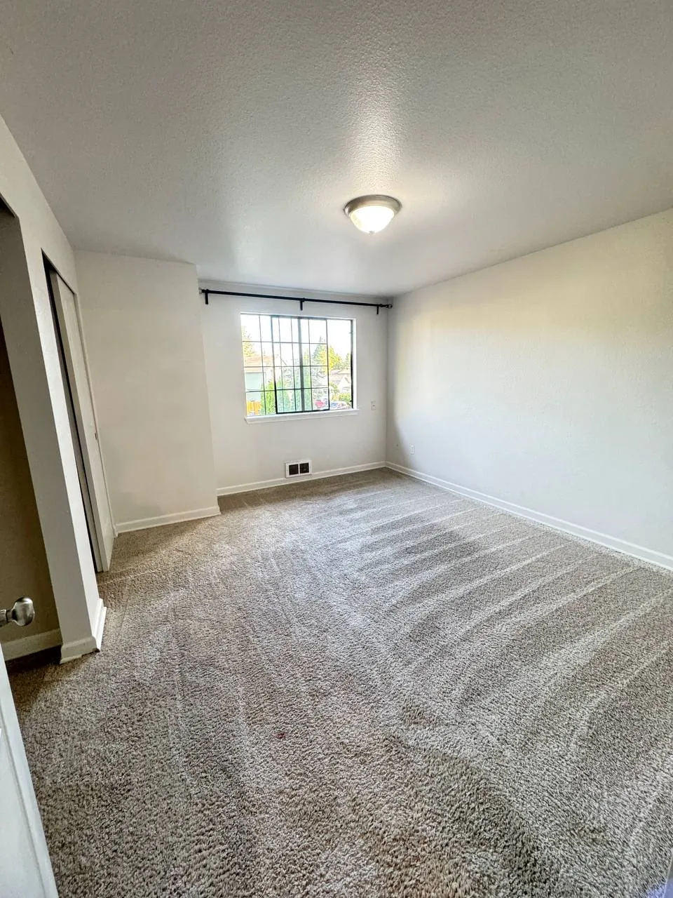After cleaning, same spot: Empty bedroom