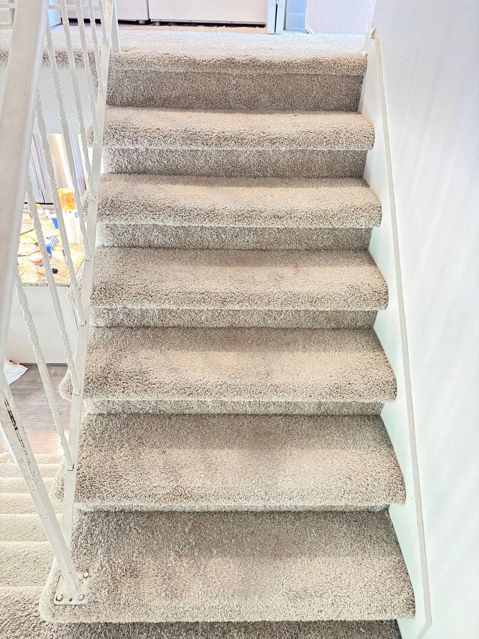 Before: staircase carpet, seen from the bottom