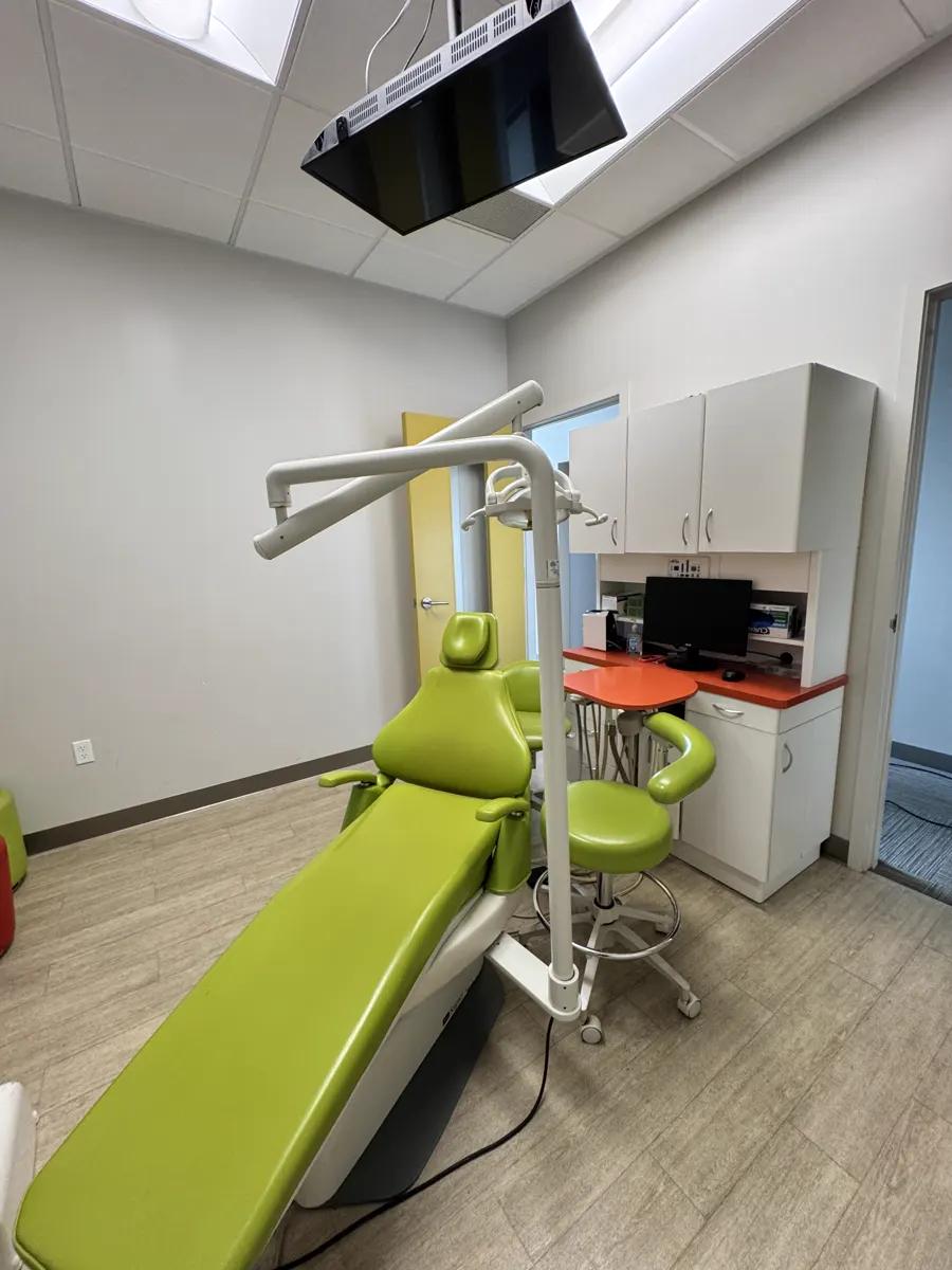 Second private operatory with reclined dental chair and workstation