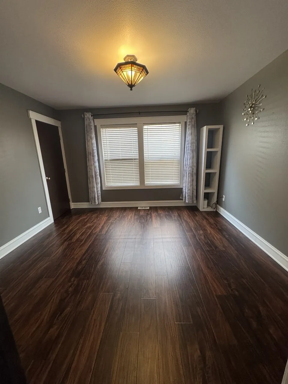 After cleaning, same spot: Move-out room, wood floor