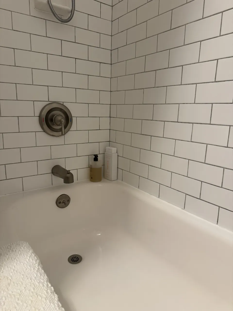 White subway tile and bathtub