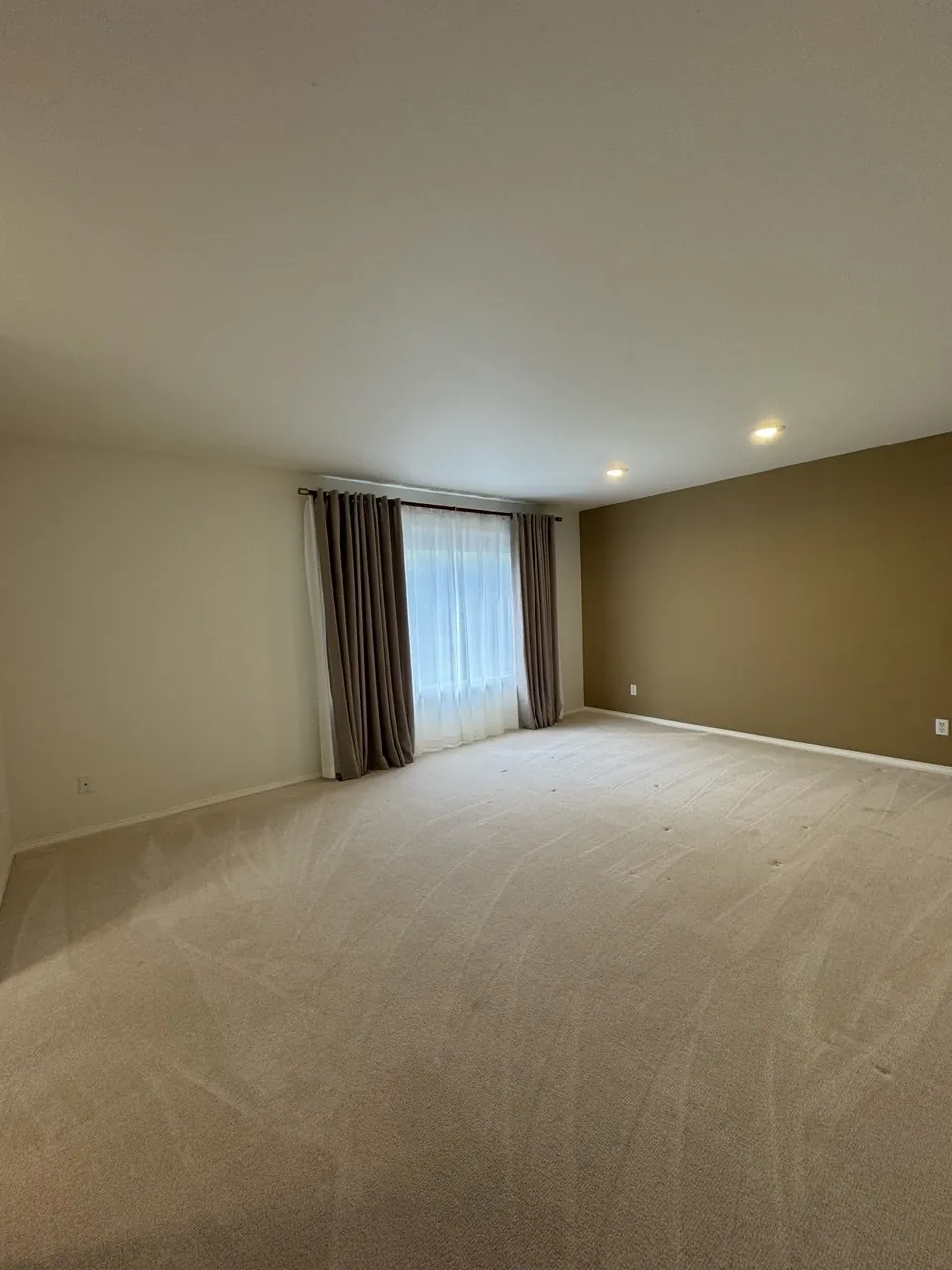 Empty bedroom with freshly cleaned carpet